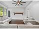 Bright living room with neutral furniture, hardwood floors, and a decorative mantle at 908 N Highland Ne Ave, Atlanta, GA 30306