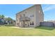 The home features a green backyard, wooden fence, and a small deck attached to the two-story house at 932 Melville Dr, Stockbridge, GA 30281