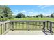 Enjoy the outdoors from this deck overlooking a lush backyard and serene landscape at 932 Melville Dr, Stockbridge, GA 30281