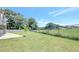 Expansive backyard featuring lush green grass and a fenced perimeter at 932 Melville Dr, Stockbridge, GA 30281