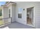 Relaxing covered balcony, seamlessly connecting to a kitchen with modern appliances at 932 Melville Dr, Stockbridge, GA 30281