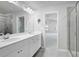 Bathroom with double vanity, glass shower and lots of natural light at 932 Melville Dr, Stockbridge, GA 30281