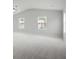 Bedroom with vaulted ceiling and fan, and multiple windows allowing for ample natural light at 932 Melville Dr, Stockbridge, GA 30281