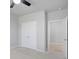 A spacious bedroom features a ceiling fan, carpet floors, and a double door closet at 932 Melville Dr, Stockbridge, GA 30281