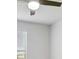 A well-lit bedroom features a window and a ceiling fan at 932 Melville Dr, Stockbridge, GA 30281
