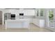 Bright kitchen with white cabinets, stainless steel appliances, and a large center island at 932 Melville Dr, Stockbridge, GA 30281