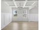 Spacious living area with a coffered ceiling, accentuated by natural light from large windows at 932 Melville Dr, Stockbridge, GA 30281