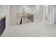 Bright, carpeted open loft space with wood and metal railing and access to multiple bedrooms at 932 Melville Dr, Stockbridge, GA 30281