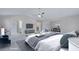 Spacious main bedroom with sitting area, vaulted ceiling, and ceiling fan at 932 Melville Dr, Stockbridge, GA 30281