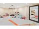 Playroom featuring neutral walls, carpet, storage shelves and large framed mirror at 4472 Cavallon Nw Way, Acworth, GA 30101