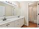 Bathroom with double sink vanity, wood floors, and a view of the tub/shower at 4472 Cavallon Nw Way, Acworth, GA 30101