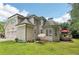 Two-story home with neutral siding, attached garage, and a deck overlooking the well-maintained lawn at 4472 Cavallon Nw Way, Acworth, GA 30101