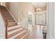 Elegant foyer with hardwood floors, high ceilings, and a staircase leading to the upper level at 4472 Cavallon Nw Way, Acworth, GA 30101