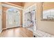 Welcoming foyer showcasing hardwood floors, high ceilings, and a charming bench at 4472 Cavallon Nw Way, Acworth, GA 30101