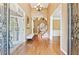 Bright and airy foyer with hardwood floors, high ceilings, and elegant architectural details at 4472 Cavallon Nw Way, Acworth, GA 30101