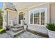 Inviting front entrance with stone steps, decorative plants, and a charming front door at 4472 Cavallon Nw Way, Acworth, GA 30101