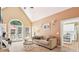 Cozy living room featuring large windows, a fireplace, and comfortable seating at 4472 Cavallon Nw Way, Acworth, GA 30101