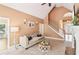 Bright living room with vaulted ceiling, neutral walls, modern furniture, and an open staircase at 4472 Cavallon Nw Way, Acworth, GA 30101