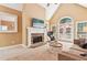 Comfortable living room showcasing a stone fireplace, vaulted ceiling, and access to the outdoors at 4472 Cavallon Nw Way, Acworth, GA 30101