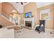 Spacious living room featuring a fireplace, high ceilings, and a view of the staircase at 4472 Cavallon Nw Way, Acworth, GA 30101