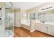 Luxurious primary bathroom with a glass shower, soaking tub, and double sink vanity at 4472 Cavallon Nw Way, Acworth, GA 30101