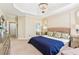 Spacious main bedroom with a tray ceiling, chandelier, and ample natural light at 4472 Cavallon Nw Way, Acworth, GA 30101