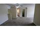 Upstairs bedroom with neutral carpet and view to bathroom at 4707 Golod Way, Lithonia, GA 30038