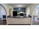 Kitchen with a breakfast bar, dark countertops, and stainless steel sink at 4707 Golod Way, Lithonia, GA 30038