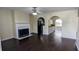 Bright living room with fireplace and arched openings to other rooms at 4707 Golod Way, Lithonia, GA 30038