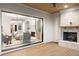 Spacious outdoor back porch with an outdoor fireplace and an indoor view of the living room at 125 Maison Court, Roswell, GA 30076