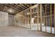 Unfinished basement with concrete walls and floors, exposed ceiling and wood framing in progress at 125 Maison Court, Roswell, GA 30076