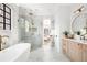 Luxurious bathroom with marble finishes, a soaking tub, and a separate glass-enclosed shower at 125 Maison Court, Roswell, GA 30076