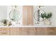 Bright bathroom featuring double sink vanity with round mirrors, and pendant lighting at 125 Maison Court, Roswell, GA 30076