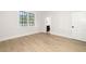 Spacious bedroom with natural light, hardwood floors, and access to the bathroom and closet at 125 Maison Court, Roswell, GA 30076