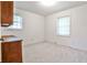 Cozy bedroom with neutral carpet, white walls, natural light, and a built-in vanity at 1338 Talcott Pl, Decatur, GA 30033