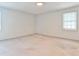Bright bedroom with neutral carpet, white walls, and a window allowing for lots of natural light at 1338 Talcott Pl, Decatur, GA 30033