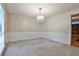 Spacious dining room with patterned wallpaper, chandelier, and a large window providing natural light at 1338 Talcott Pl, Decatur, GA 30033