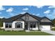 Inviting single-story home with stone accents, neutral colors, manicured lawn, and a two-car garage at 568 Barnfield Way, Dallas, GA 30157