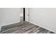 The bedroom features wood-look floors, and an entry to another room through a partially visible doorway at 2079 Wellborn Rd, Lithonia, GA 30058