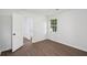 Bedroom featuring neutral walls, wood floors, and a window with natural light at 2079 Wellborn Rd, Lithonia, GA 30058
