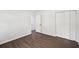 Bedroom featuring wood floors, neutral walls, and a closet at 2079 Wellborn Rd, Lithonia, GA 30058