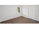 Bright bedroom featuring neutral walls, wood floors, and a closet at 2079 Wellborn Rd, Lithonia, GA 30058