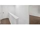 Hallway with wood floors, white walls, and a door at 2079 Wellborn Rd, Lithonia, GA 30058