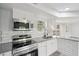 Modern kitchen featuring stainless steel appliances, granite countertops, and subway tile backsplash at 2079 Wellborn Rd, Lithonia, GA 30058