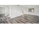 Bright living room features modern flooring, fresh paint, staircase and a large window at 2079 Wellborn Rd, Lithonia, GA 30058