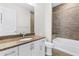 Modern bathroom featuring granite countertops, tile flooring and shower backsplash, and bathtub at 270 17Th Nw St # 4306, Atlanta, GA 30363