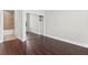 Bright bedroom featuring hardwood floors, ensuite bathroom, and closet with mirrored sliding doors at 270 17Th Nw St # 4306, Atlanta, GA 30363