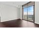 Bedroom featuring hardwood floors and large windows with great city views at 270 17Th Nw St # 4306, Atlanta, GA 30363