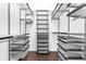 A custom closet with multiple rows of shelves and wire storage baskets at 270 17Th Nw St # 4306, Atlanta, GA 30363
