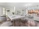 Bright dining area featuring a modern table, seating for eight, and an open-concept kitchen at 270 17Th Nw St # 4306, Atlanta, GA 30363